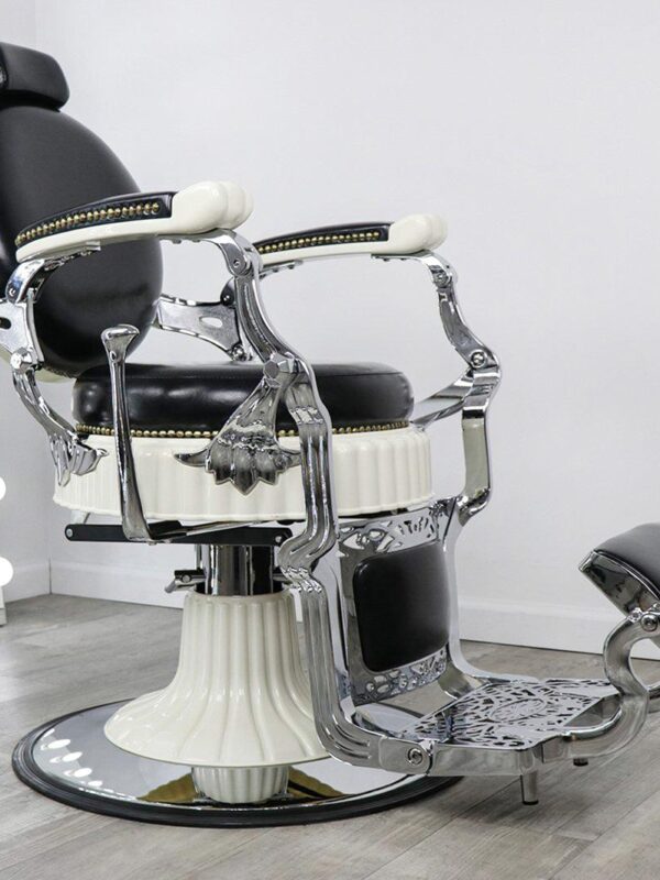 vintage barber shop chairs Emerson barber chair in black professional vinyl with vertical line stitching, polished chrome accents, and a heavy-duty hydraulic base.