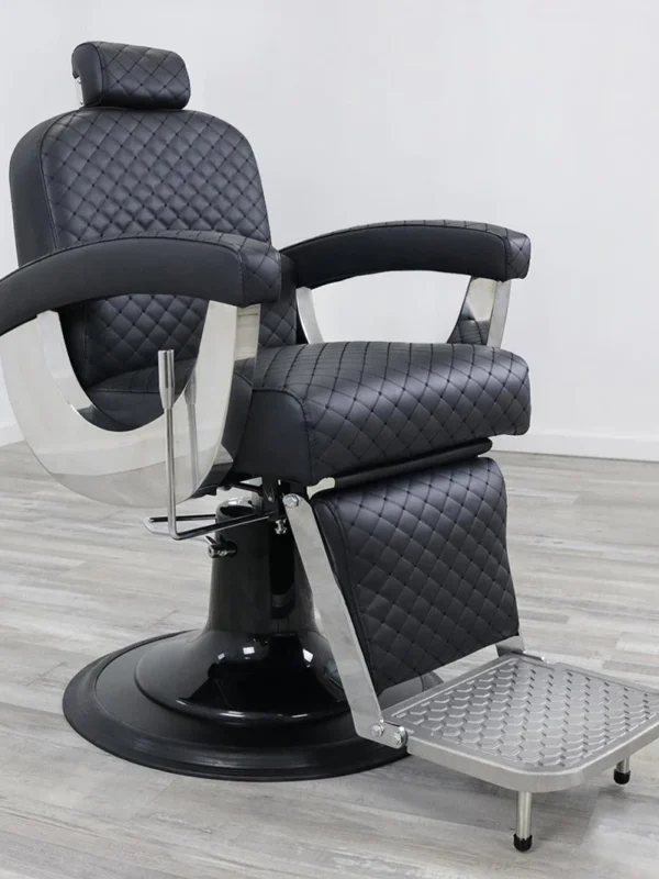 belmont barbers chair Knight barber chair featuring black vinyl with a diamond-stitched pattern, mirrored chrome metal armrests, and a heavy-duty hydraulic base.