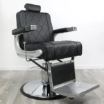 barber chairs for sale Adams vintage-style barber chair in matte black vinyl with button-tufted backrest, chrome hydraulic base, and adjustable headrest.