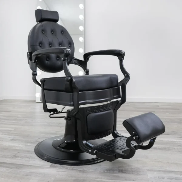 barber chair for sale Blackout barber chair in matte black vinyl with a tufted backrest, black powder-coated hydraulic base, and reclining handle.
