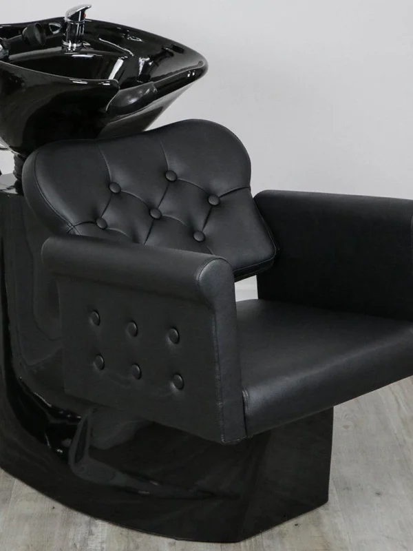 shampoo sink and chair Luxury Glam shampoo backwash unit featuring a polished gold stainless steel frame, white tufted upholstery, and a deep tilting black ceramic bowl.