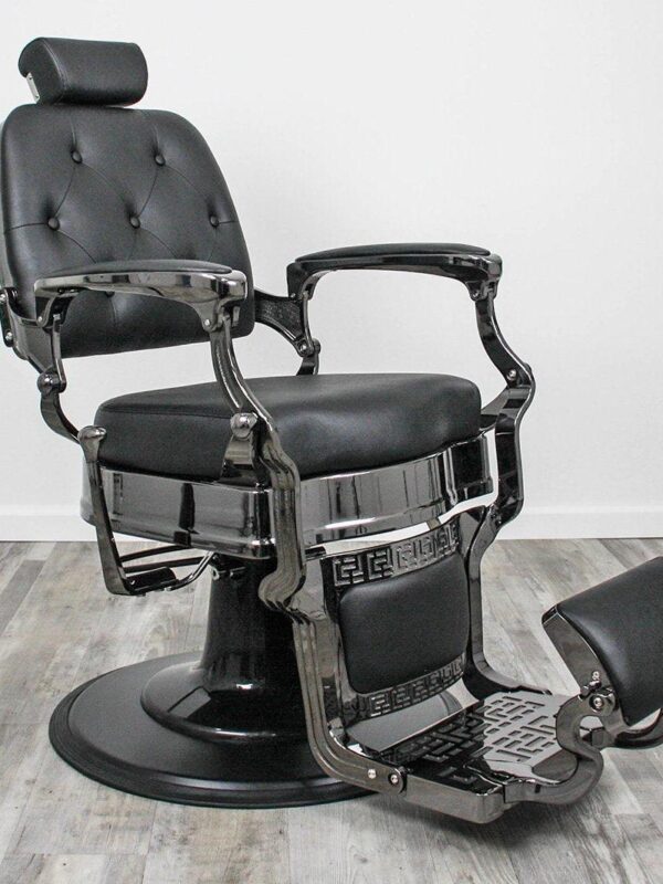 black barber shop chairs Durable Knockout barber chair with reinforced metal framing, high-density black padded cushions, and a heavy-duty hydraulic round base for professional barbershops.