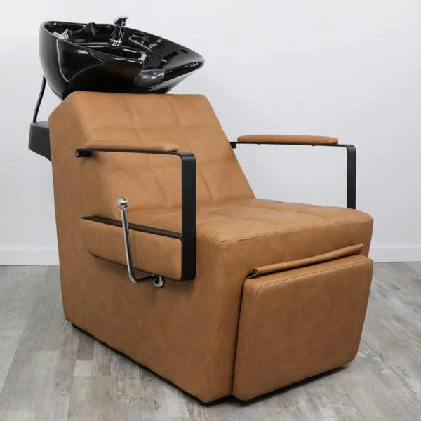 shampoo chair for salon Savannah shampoo backwash unit featuring elegant diamond-quilted side stitching, black vinyl upholstery, and an adjustable tilting black ceramic bowl.