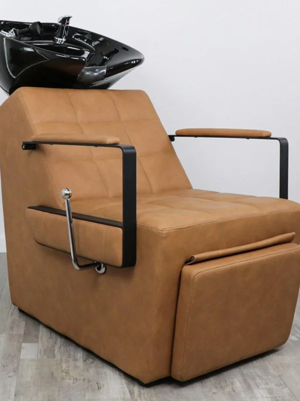 shampoo chair for salon Savannah shampoo backwash unit featuring elegant diamond-quilted side stitching, black vinyl upholstery, and an adjustable tilting black ceramic bowl.