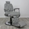 koken barber chairs Professional Supreme barber chair featuring a classic tufted backrest, reinforced chrome armrests, and a high-capacity hydraulic base for grooming.