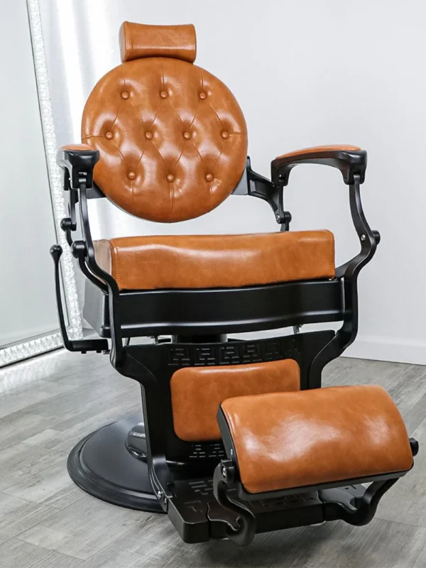 modern barber shop chairs Xavier barber chair featuring a professional cast iron NG1 pump, black steel base, and high-density plush cushions for heavy-duty barbershop use.