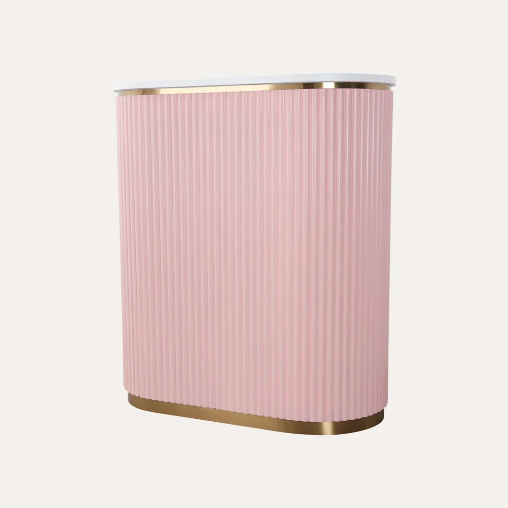 A cozy and modern hair salon interior with the "James Barber Shop" sign prominently displayed. In the foreground, a sleek leather styling chair and a vintage-inspired barber's chair with chrome accents. In the middle ground, a marble-topped styling station with a retro-style mirror and brass lighting fixtures. The background features exposed brick walls, polished concrete floors, and lush potted plants, creating a chic and inviting atmosphere. Warm lighting from overhead industrial-style lamps casts a soft glow throughout the space, accentuating the high-end, salon-inspired vibe.