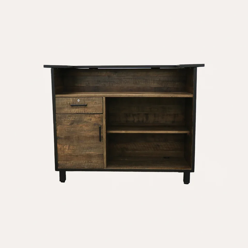 A trendy salon front desk in a warm, inviting color palette. The main focus is a sleek, modern reception desk with clean lines and a minimalist design, crafted from light-colored wood and accented with brushed metal hardware. Softly diffused lighting emanates from recessed ceiling fixtures, creating a cozy, atmospheric ambiance. In the background, a feature wall showcases the salon's branding - "James Barber Shop" - rendered in stylized typography. Potted plants and carefully curated decor elements add pops of greenery and texture, complementing the overall sophisticated yet approachable aesthetic.